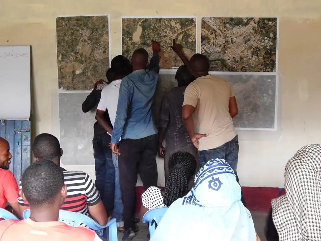 Community members helping to locate spatial issues@Baraka Mwau