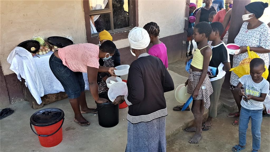 Residents wait for food parcels in Kwa Zulu Natal province