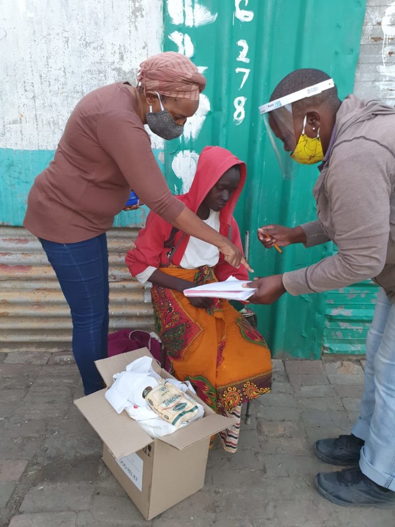 Distributing food parcels in North West