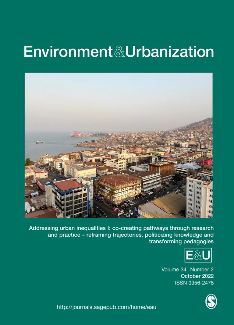 The image is a cover image from the journal Environment & Urbanisation. The cover depicts a sprawling City nestled in a Bay. The City sweeps from the bay up onto a hill. The journal is Volume 34, Number 2 and it was published in October of 2022.